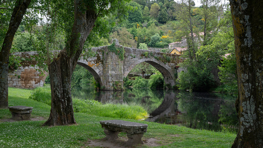 Medieval stone bridge over a river in Ourense, Galicia