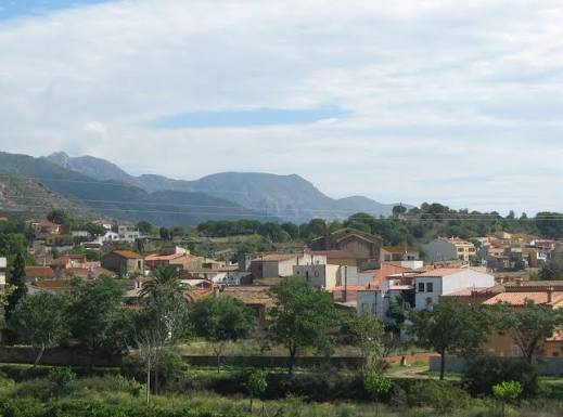The village of Vilajuïga on the plain beneath the Serra de Rodes
