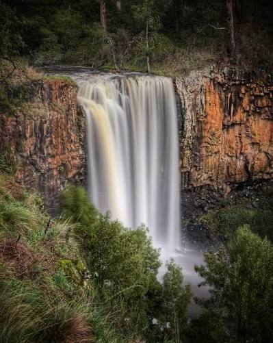 A waterfall over basalt cliffs in regional Victoria