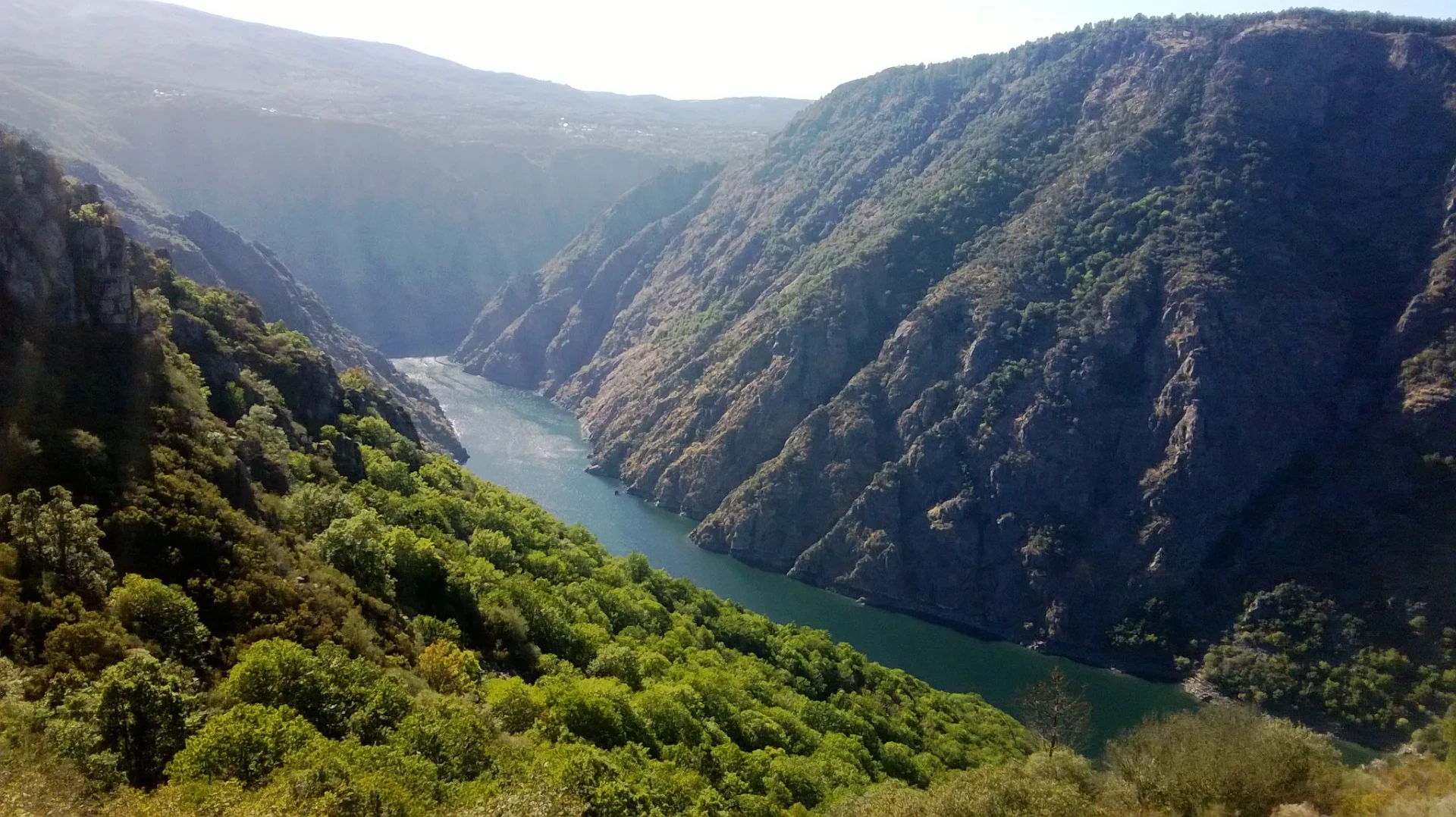 The Sil river canyon cutting through steep green slopes in Galicia